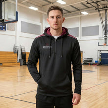 Load image into Gallery viewer, Black and maroon Heritage Hoodie being worn by a school PE teacher standing in the schools sports hall.