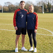 Load image into Gallery viewer, 2 Models wearing the Scorpion Sports Pro Drill Tops, standing on a sports field.
