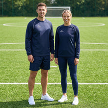 Load image into Gallery viewer, Navy Softshell Teamwear Drill Top on a man and lady standing on a sports field
